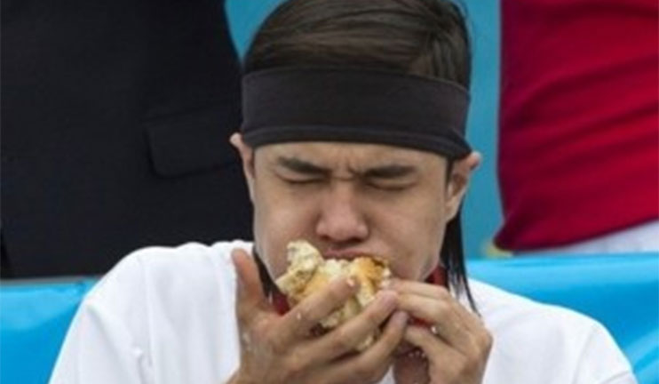 23-year-old young man wins in the contest by eating 62 hotdogs in 10 minutes