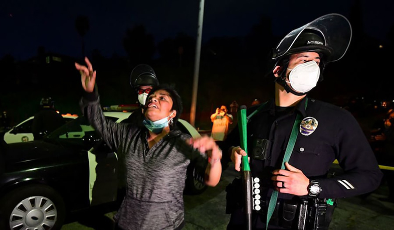 Protesters, L.A. police clash over crackdown on homeless encampment