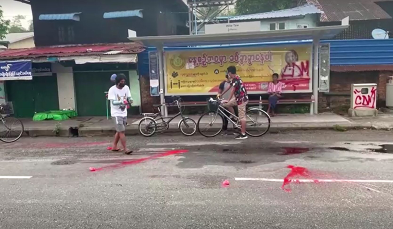 Myanmar protesters throw red paint on streets to challenge coup