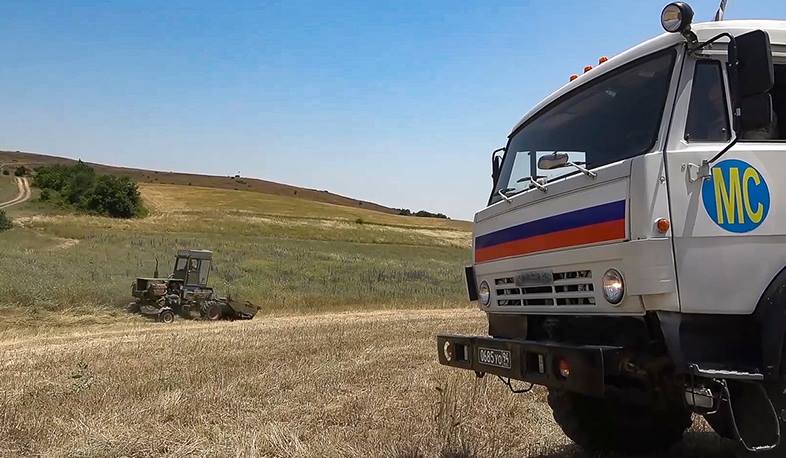 Russian peacekeepers ensure the safety of local residents carrying out hay harvesting in the Askeran district