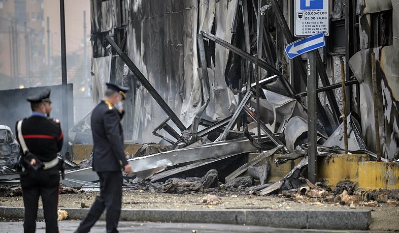 Italy: 'Eight killed' as light plane crashes into empty office building in Milan suburb