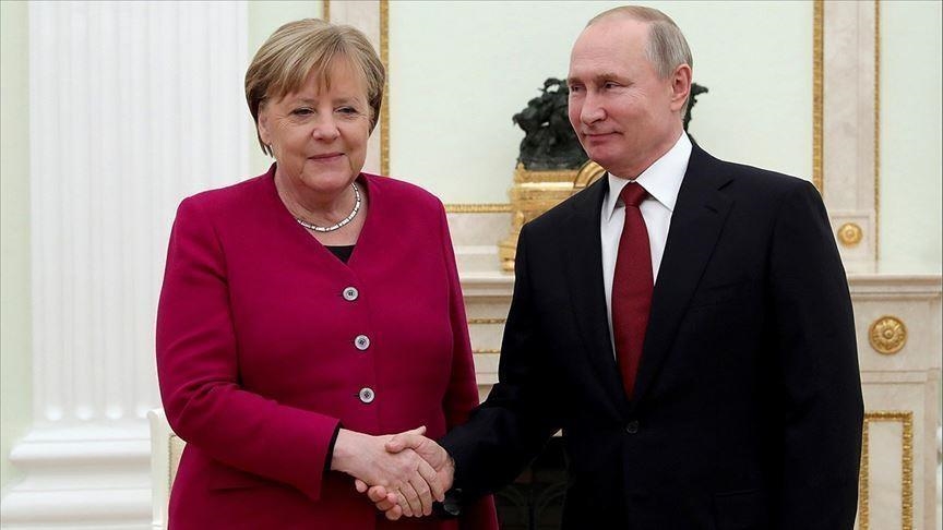 Merkel asks Putin to help resolve migrant crisis on Belarus-EU border