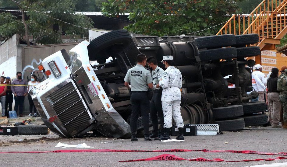 Mexico truck crash: At least 53 people killed as trailer overturns