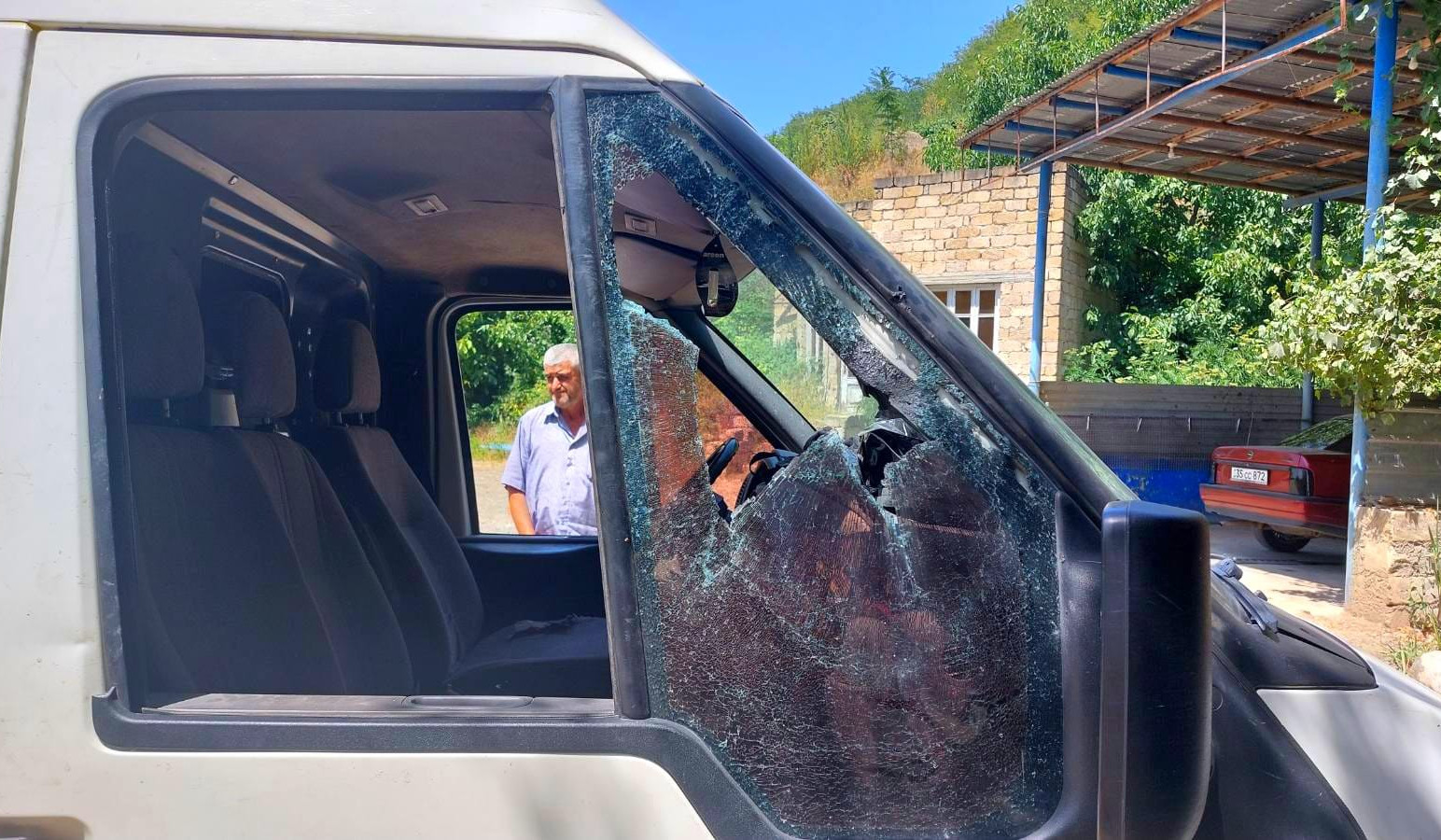 Civilian car damaged in Nagorno-Karabakh by shots fired from Azerbaijani positions