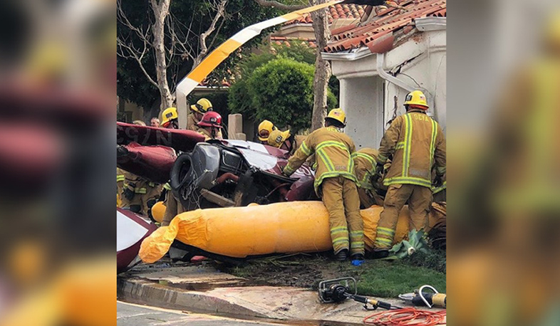 Helicopter crashes into house