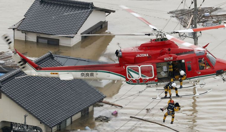 International agenda: flood kills over 100 in Japan