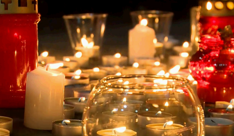 Candles burn in Aznavour Square for famous singer