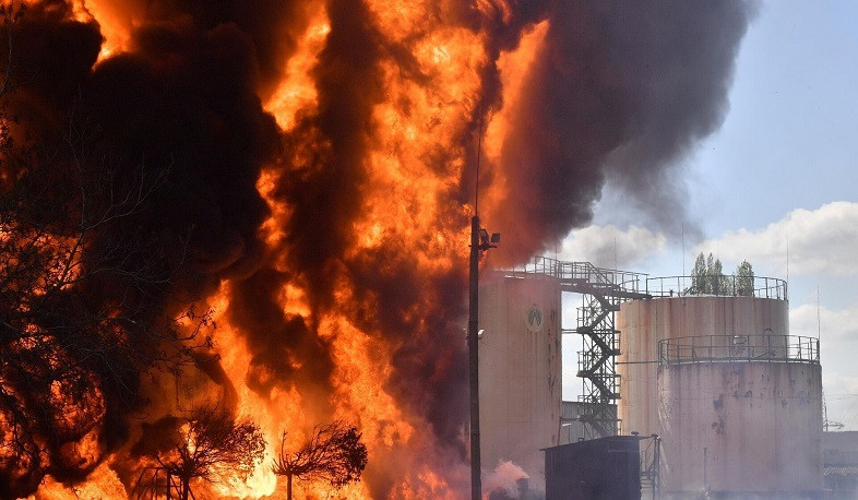 Shelling kills 4 in Ukraine as a drone attack sparks fire at an oil depot in Russia