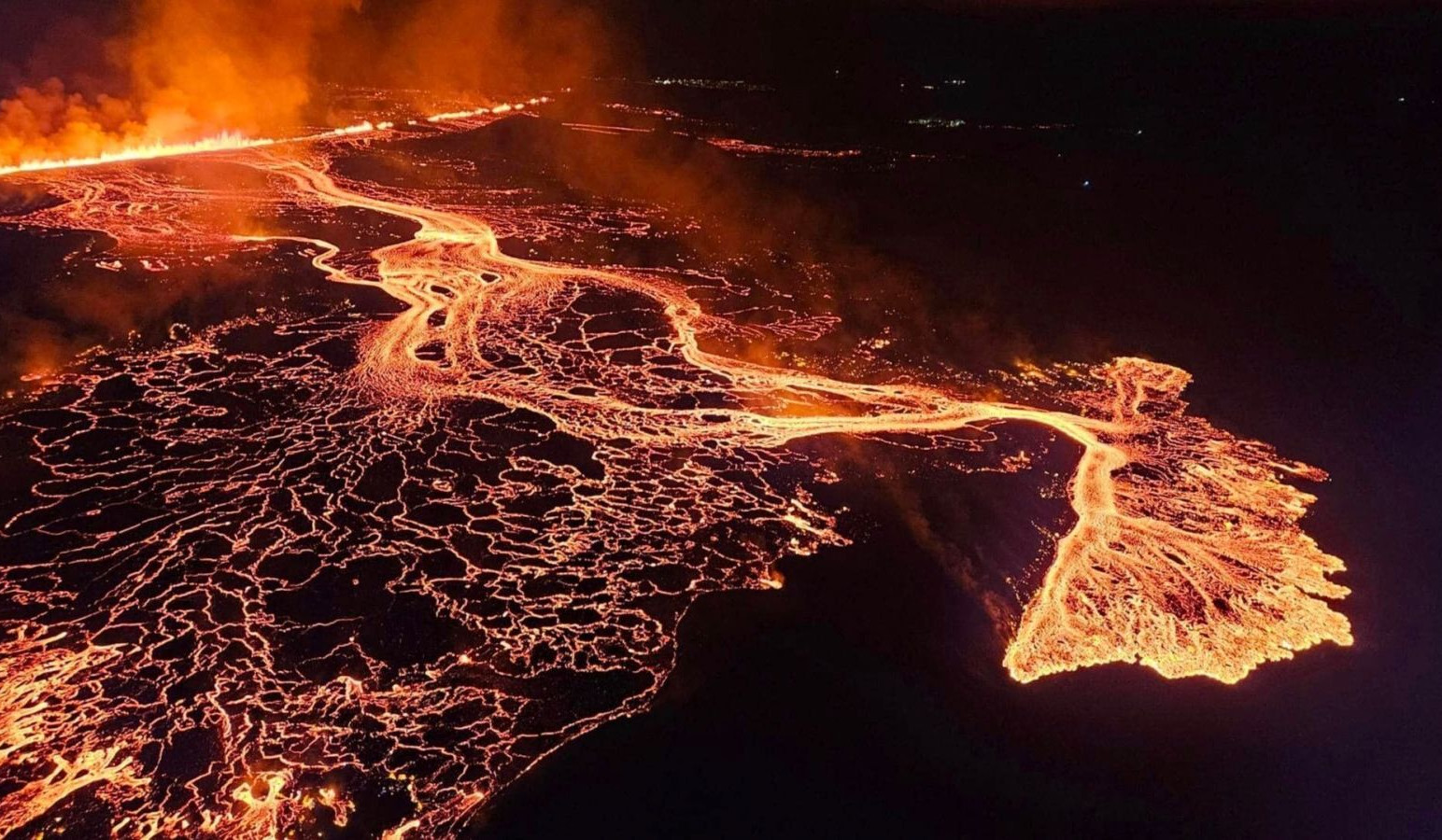 Aerial footage shows Iceland volcano spewing lava at night