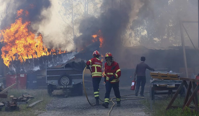 Flames burn near homes, along roads as death toll climbs to 7 in Portugal wildfires