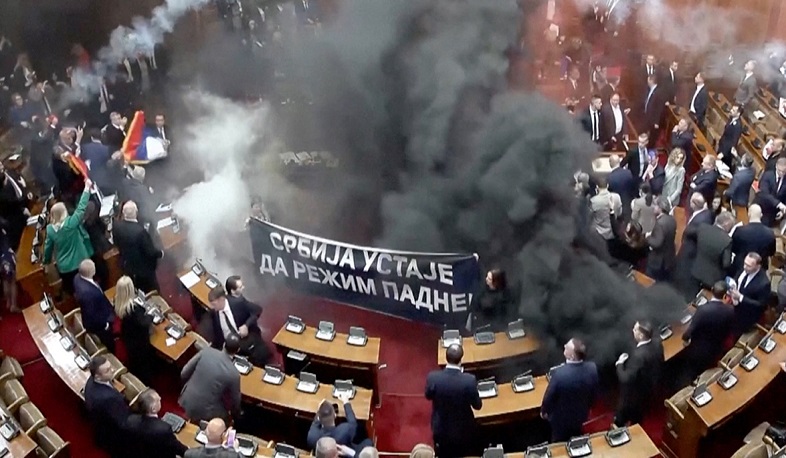 Opposition lawmakers let off smoke grenades in Serbian parliament