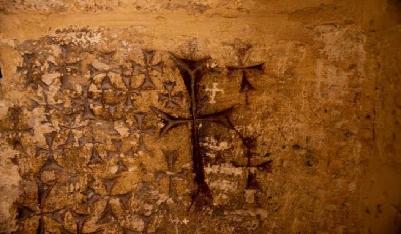 Graffiti or homage? Hi-tech imaging sheds light on Holy Sepulchre wall crosses