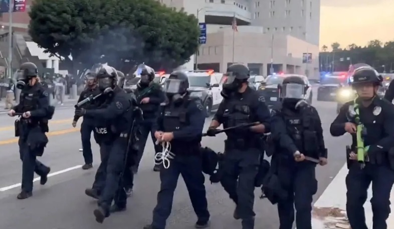 Riot police, anti-ICE protesters square off in Los Angeles after raids