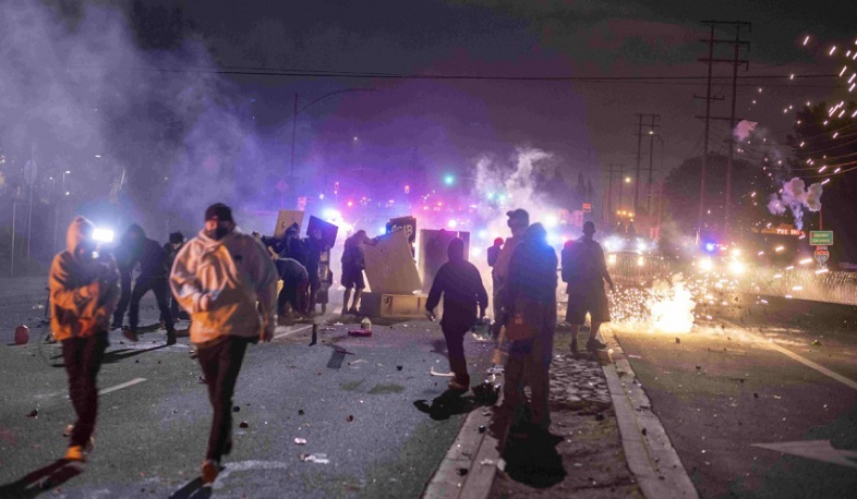 Protesters clash with law enforcement officers in Los Angeles