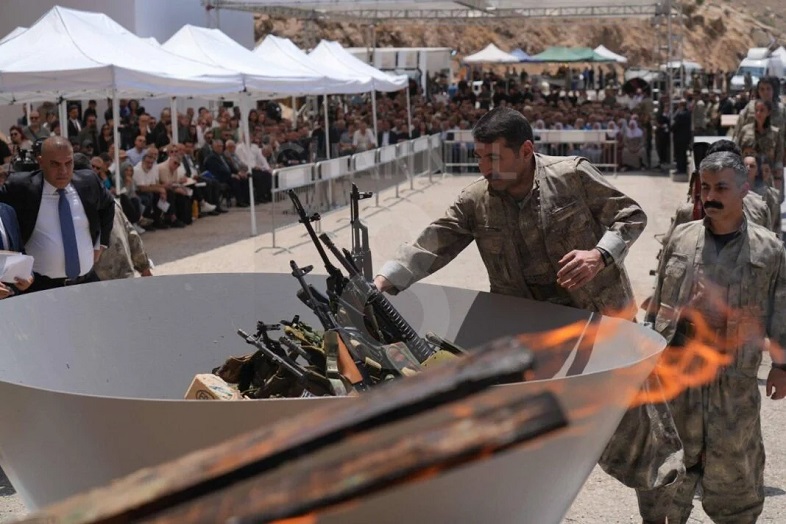 PKK fighters burn weapons during disarming ceremony in Iraqi Kurdistan