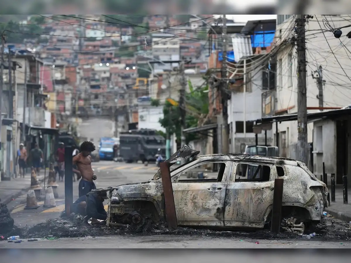 At least 64 killed in Rio police raids ahead of climate conferences