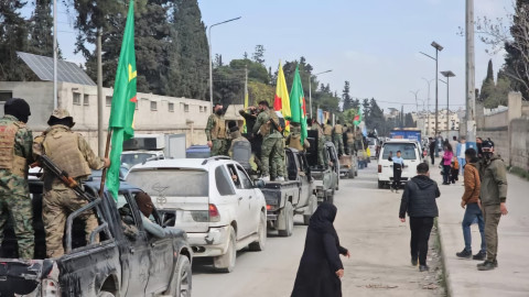 Kurdish fighters leave northern city in Syria as part of deal with central government