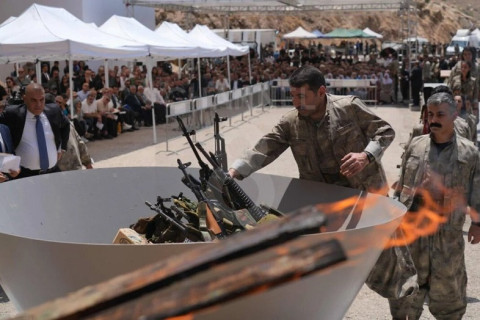 PKK fighters burn weapons during disarming ceremony in Iraqi Kurdistan