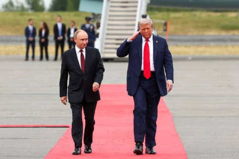 Putin sees 'light at the end of the tunnel' in Russia-US relations