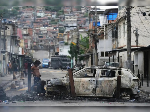 At least 64 killed in Rio police raids ahead of climate conferences